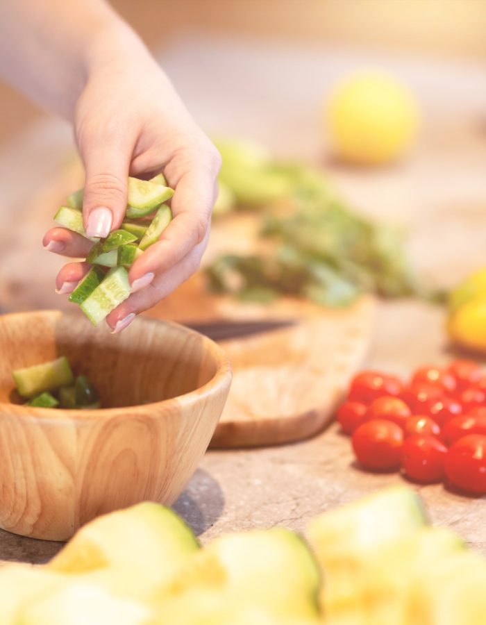 Eat healthy. Woman is preparing a salad